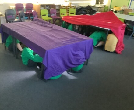 Year 6 Pupils Hiding Under the Tables Pretend Air Raid Shelters