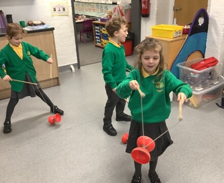 Children Playing with Spinning Toys
