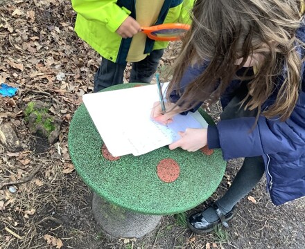 Year 2 Pupils Recording Nature Hunt Findings