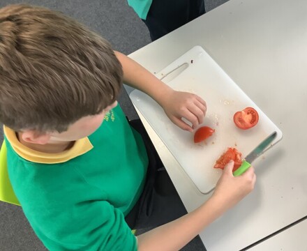 Pupil Preparing Tomoatoes